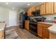 Kitchen featuring wooden cabinets, neutral countertops and stainless steel appliances at 1690 Sw 158Th Ln, Ocala, FL 34473