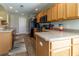 Kitchen featuring wooden cabinets, neutral countertops and stainless steel appliances at 1690 Sw 158Th Ln, Ocala, FL 34473
