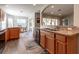 Lovely kitchen with stainless steel dishwasher, wood cabinets and view of the breakfast nook at 1690 Sw 158Th Ln, Ocala, FL 34473