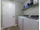 Laundry area with modern washer and dryer, offering convenience and efficiency at 1690 Sw 158Th Ln, Ocala, FL 34473