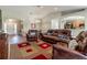 Inviting living room with an open floor plan, wood-look floors, comfortable furniture and abundant light at 1690 Sw 158Th Ln, Ocala, FL 34473