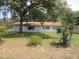 Charming one-story home with mature trees and a well-maintained lawn, perfect for outdoor enjoyment at 17315 Se 18Th St, Silver Springs, FL 34488