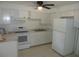 Bright kitchen features white cabinetry, modern appliances, and ample counter space at 17315 Se 18Th St, Silver Springs, FL 34488