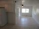 Open-concept living area with tile flooring, providing a spacious and versatile layout at 17315 Se 18Th St, Silver Springs, FL 34488