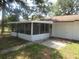 A fully screened patio that provides ample space for outdoor seating and entertaining at 17315 Se 18Th St, Silver Springs, FL 34488