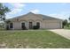 Charming single-story home with a well-maintained lawn and attached two-car garage at 1754 Sw 160Th Pl, Ocala, FL 34473