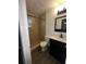 Bathroom featuring walk-in shower, dark wood vanity, and modern fixtures at 1809 Sw 29Th Ter, Ocala, FL 34474