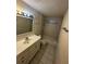 Bathroom with modern vanity, tile flooring, and a shower-tub combination at 1809 Sw 29Th Ter, Ocala, FL 34474