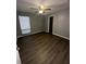 Bedroom featuring updated flooring, ceiling fan, and natural light from the window at 1809 Sw 29Th Ter, Ocala, FL 34474