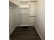 Well-organized closet space with wooden rod and built-in shelving, providing ample storage at 1809 Sw 29Th Ter, Ocala, FL 34474