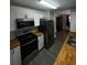 Modern kitchen featuring stainless steel appliances, sleek cabinets, and butcher block countertops at 1809 Sw 29Th Ter, Ocala, FL 34474