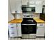 Close-up of a modern kitchen featuring stainless steel appliances and stylish backsplash at 1809 Sw 29Th Ter, Ocala, FL 34474