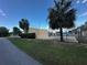 Exterior tennis court with a fenced perimeter and lush landscaping adding to the recreational amenities at 1809 Sw 29Th Ter, Ocala, FL 34474