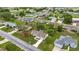 Aerial view showcasing a landscaped home near a pond and golf course at 2158 Nw 50Th Ave, Ocala, FL 34482