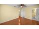 Bedroom with hardwood floors, ceiling fan, and ensuite bathroom at 2158 Nw 50Th Ave, Ocala, FL 34482