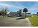 Clubhouse showing architecture and parking with golf course nearby at 2158 Nw 50Th Ave, Ocala, FL 34482