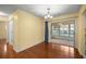 Dining room with chandelier, sliding glass doors, and wood floors, offering a seamless transition to outdoor space at 2158 Nw 50Th Ave, Ocala, FL 34482