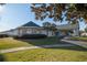 Well-manicured lawn and shrubbery leading up to an inviting building with architectural details at 2158 Nw 50Th Ave, Ocala, FL 34482