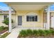 Close-up of the welcoming front porch, showcasing white railings and neat landscaping at 2158 Nw 50Th Ave, Ocala, FL 34482