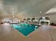 Beautiful indoor pool with natural light, with an attached seating area for community enjoyment at 2158 Nw 50Th Ave, Ocala, FL 34482