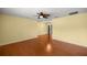 A shot of the living room showcasing hardwood floors and open access to the dining area at 2158 Nw 50Th Ave, Ocala, FL 34482