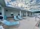 The pool deck featuring lounge chairs and ceiling fans for relaxation at 2158 Nw 50Th Ave, Ocala, FL 34482