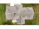 Aerial view of roof showing the architectural design, roofline, and landscaping at 2158 Nw 50Th Ave, Ocala, FL 34482