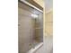 Bathroom featuring a walk-in shower with glass doors and tiled walls at 2158 Nw 50Th Ave, Ocala, FL 34482