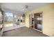 Sunroom featuring sliding glass door entry into kitchen, and large windows at 2158 Nw 50Th Ave, Ocala, FL 34482
