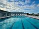 Large community swimming pool with lounge seating along the pool deck at 2158 Nw 50Th Ave, Ocala, FL 34482