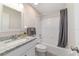 Bathroom featuring a shower-tub combination and granite countertop vanity with white cabinets at 2220 Ne 41St St, Ocala, FL 34479