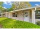 Close up of the front door with well maintained landscaping at 2220 Ne 41St St, Ocala, FL 34479