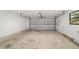 Spacious garage with an automatic door offers plenty of room for parking and storage at 2220 Ne 41St St, Ocala, FL 34479