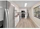 Updated kitchen features stainless steel appliances, white cabinets, and modern countertops at 2220 Ne 41St St, Ocala, FL 34479