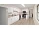 Beautiful kitchen features stainless steel appliances, modern lighting, and plenty of cabinet space at 2220 Ne 41St St, Ocala, FL 34479