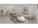 Staged living room showcasing modern flooring, a dining area and plenty of natural light at 2220 Ne 41St St, Ocala, FL 34479