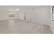 Bright living room featuring neutral paint, modern floors and a ceiling fan at 2220 Ne 41St St, Ocala, FL 34479