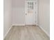 Entry area features a door with windows and neutral walls, leading to a bright space at 2220 Ne 41St St, Ocala, FL 34479