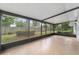 Relaxing screened-in porch offers views of the backyard and surrounding landscape at 2220 Ne 41St St, Ocala, FL 34479