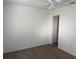 Bedroom features a ceiling fan and carpet flooring at 227 Fisher Run, Ocklawaha, FL 32179