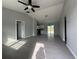 Spacious living room features recessed lights, tile floors and neutral paint, flowing into the kitchen area at 28 Bahia Pass Dr, Ocala, FL 34472