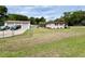 A quaint single-story home with a detached two-car garage in a spacious, grassy yard at 2848 Se 11Th St, Ocala, FL 34471