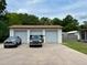 This garage has three bays and a large driveway at 2848 Se 11Th St, Ocala, FL 34471