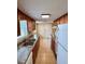 A galley kitchen featuring wood cabinets, granite countertops, and a white refrigerator at 2848 Se 11Th St, Ocala, FL 34471