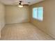 Spacious living room featuring neutral paint, tile flooring, and a ceiling fan at 2848 Se 11Th St, Ocala, FL 34471
