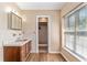 Bathroom with tile details, a vanity sink, and a walk-in shower at 3950 Se 10Th Ln, Ocala, FL 34471