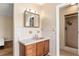 Bathroom with a vanity, tile details, and a walk-in shower at 3950 Se 10Th Ln, Ocala, FL 34471