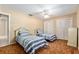 Bedroom features carpeting, neutral paint, two closets, two beds and a ceiling fan at 3950 Se 10Th Ln, Ocala, FL 34471