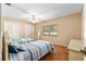Bedroom features carpeting, neutral paint, two closets, two beds and a ceiling fan at 3950 Se 10Th Ln, Ocala, FL 34471