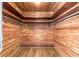Closet with wood plank walls, storage shelving, and wood-look floors at 3950 Se 10Th Ln, Ocala, FL 34471